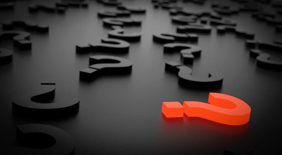 An image of illuminated question marks.